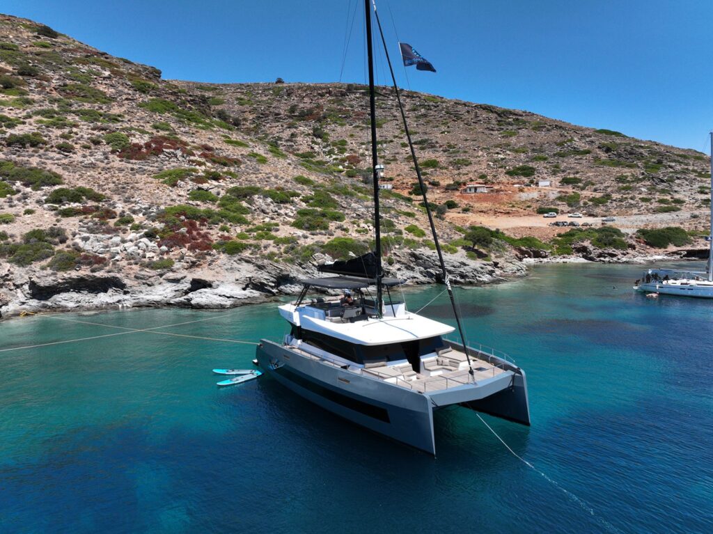 Moonlight, a Moon 60 Sail catamaran, at anchor in a Greek bay